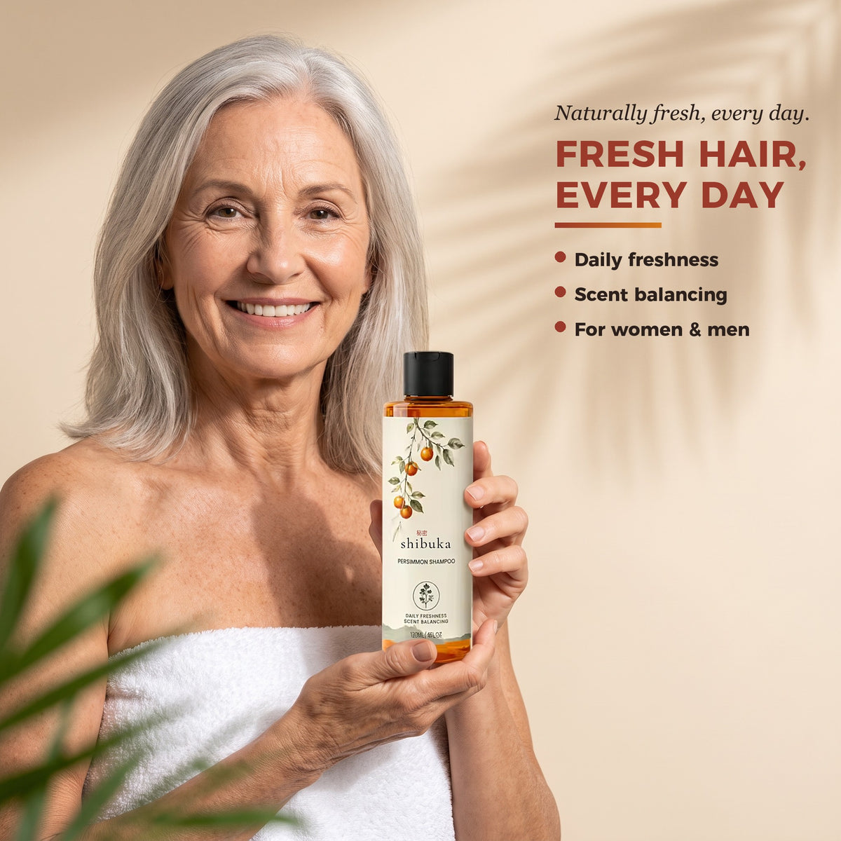 Woman holding Shibuka Persimmon Shampoo